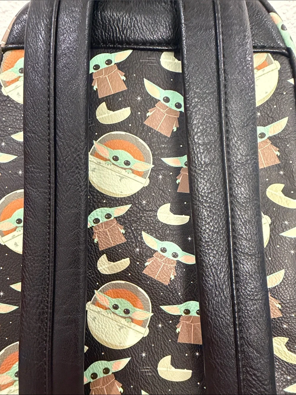 Loungefly Black Baby Yoda Pattern Mini Backpack with Green and Brown Accents